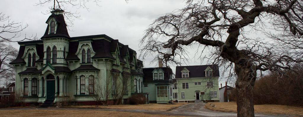 A street view of a run-down, haunted Victorian home in Saint John, New Brunswick.